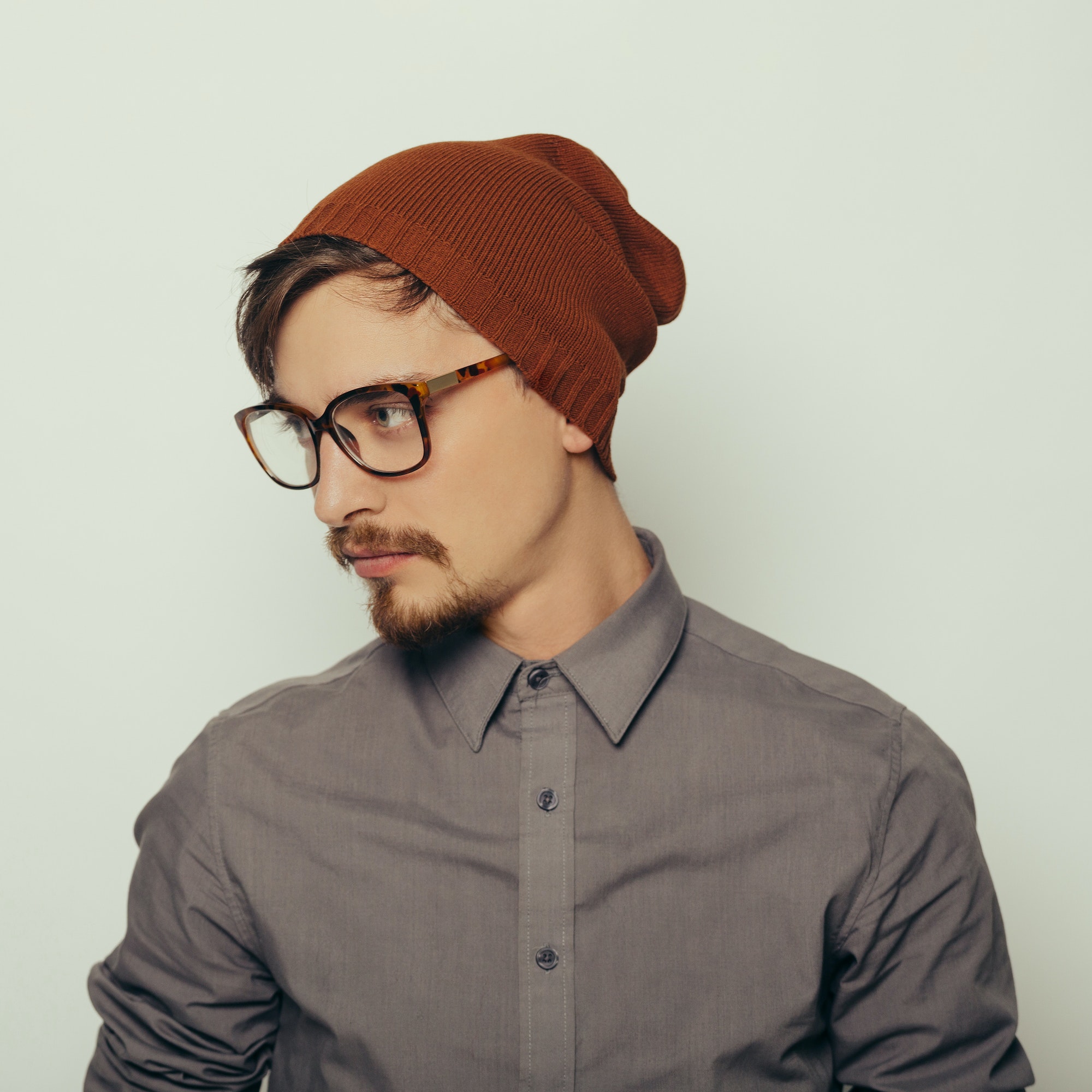 Home portrait of an interesting young man in winter clothes.jpg